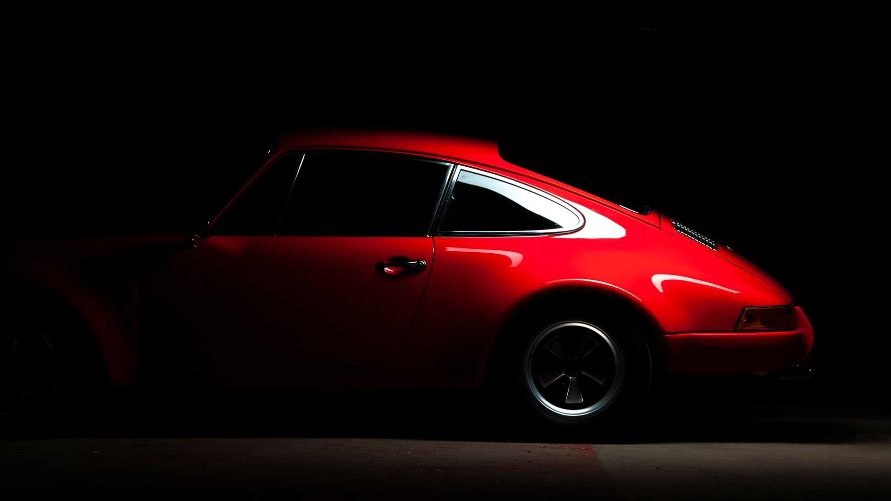 Red classic Porsche 911 in profile
