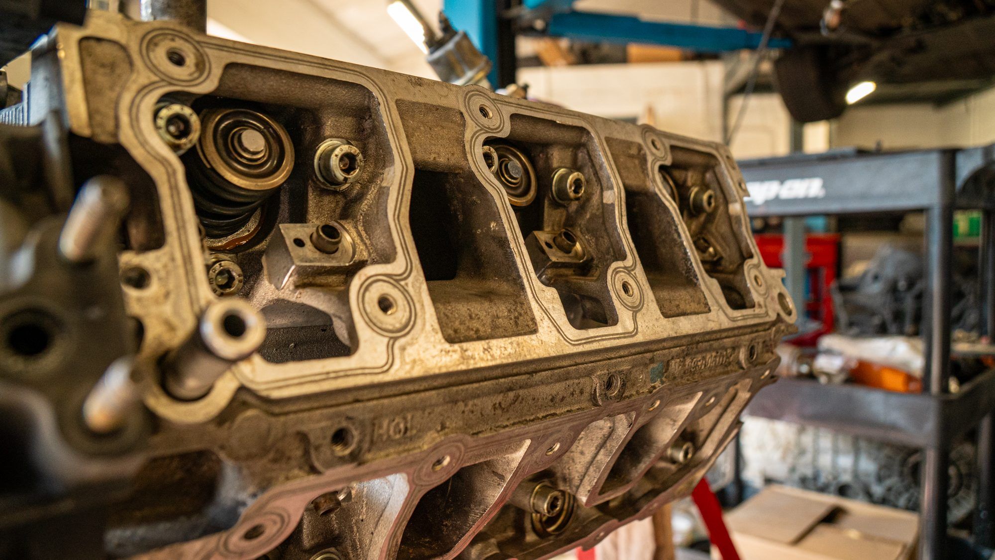 Porsche cylinder head on a stand during an engine rebuild