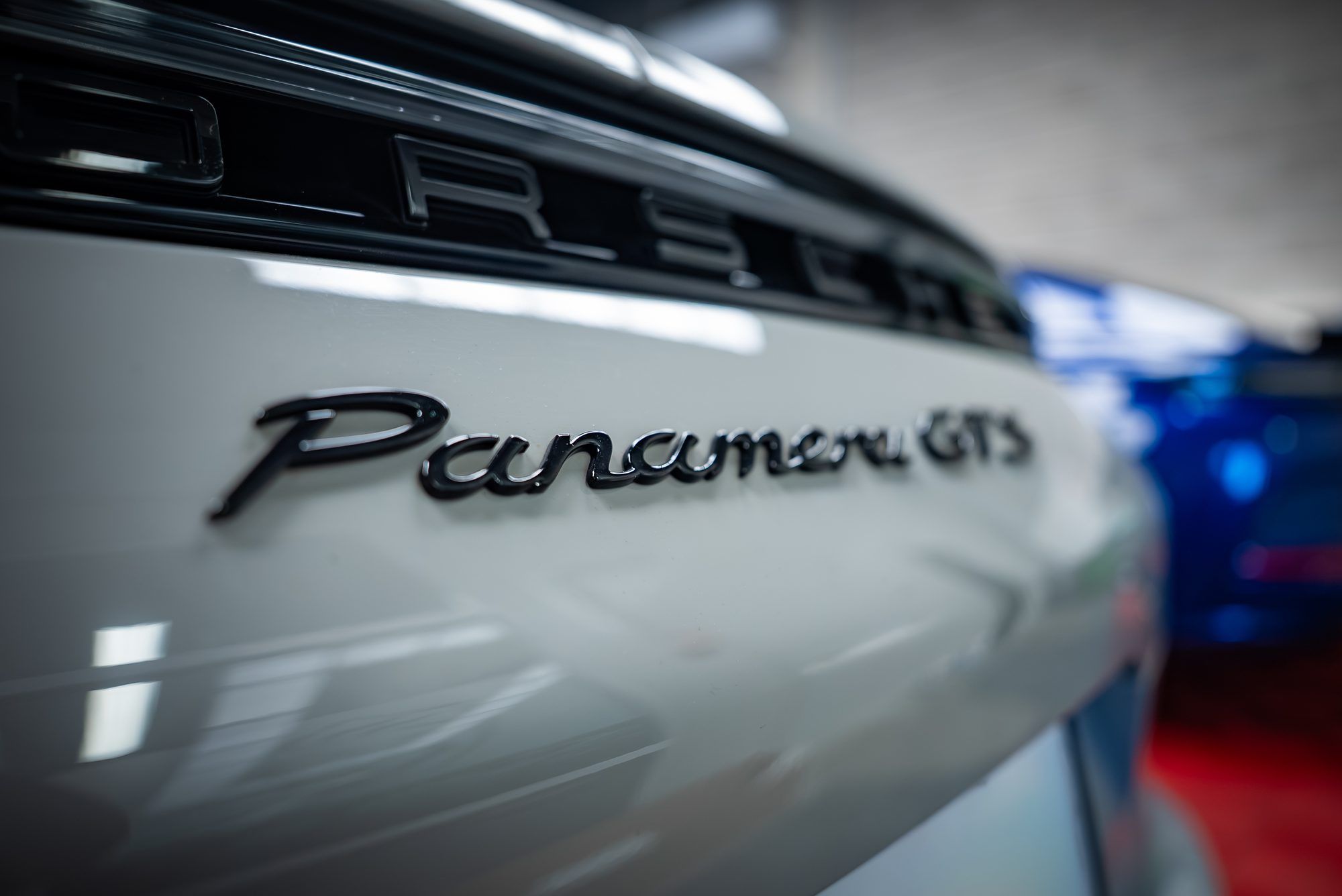 Panamera GTS badge on a white Porsche Panamera